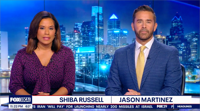 Two news anchors, Shiba Russell and Jason Martinez, are shown on screen with a city skyline in the background. Below them, text reads "FOX LOCAL SHIBA RUSSELL | JASON MARTINEZ 11:22 PM 63° S IRAN 'WILL PAY' FOR LAUNCHING NEARLY 200 MISSILES AT ISRAEL FOX29 P HEADLINES".